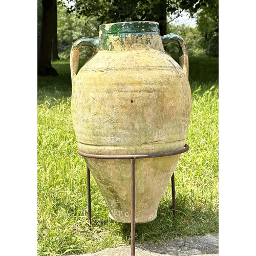 274 - GARDEN AMPHORA, vintage weathered terracotta with moulded loop handles and glazed neck on iron stand... 