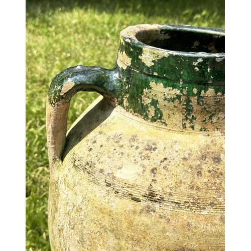 274 - GARDEN AMPHORA, vintage weathered terracotta with moulded loop handles and glazed neck on iron stand... 