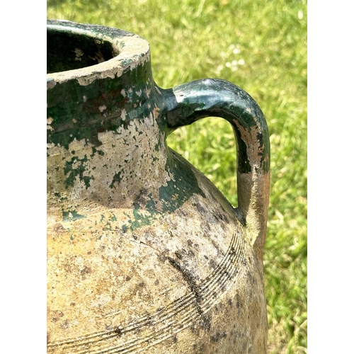 274 - GARDEN AMPHORA, vintage weathered terracotta with moulded loop handles and glazed neck on iron stand... 