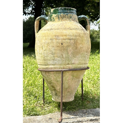 274 - GARDEN AMPHORA, vintage weathered terracotta with moulded loop handles and glazed neck on iron stand... 