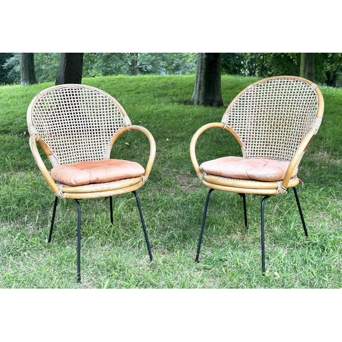 275 - TERRACE ARMCHAIRS, a pair, 1970s rattan framed wicker panelled and cane bound with metal supports, 6... 