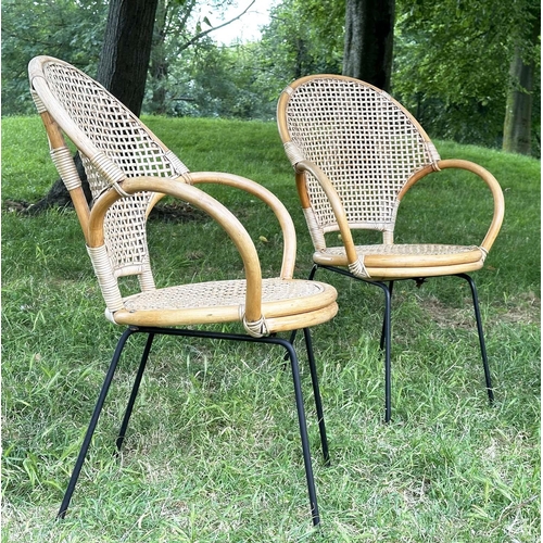 275 - TERRACE ARMCHAIRS, a pair, 1970s rattan framed wicker panelled and cane bound with metal supports, 6... 