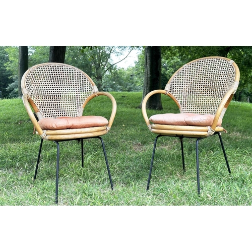 275 - TERRACE ARMCHAIRS, a pair, 1970s rattan framed wicker panelled and cane bound with metal supports, 6... 