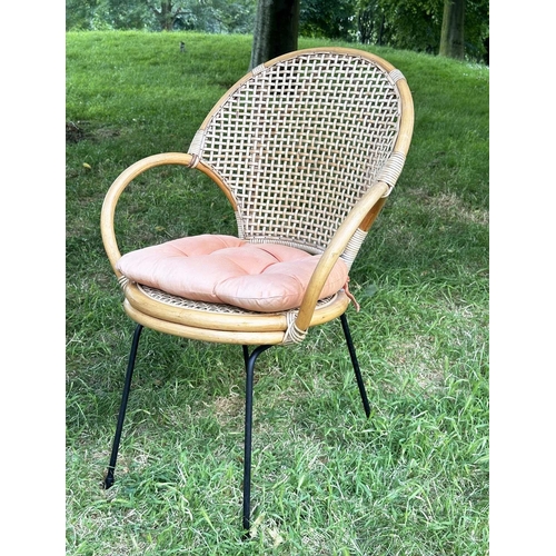 275 - TERRACE ARMCHAIRS, a pair, 1970s rattan framed wicker panelled and cane bound with metal supports, 6... 