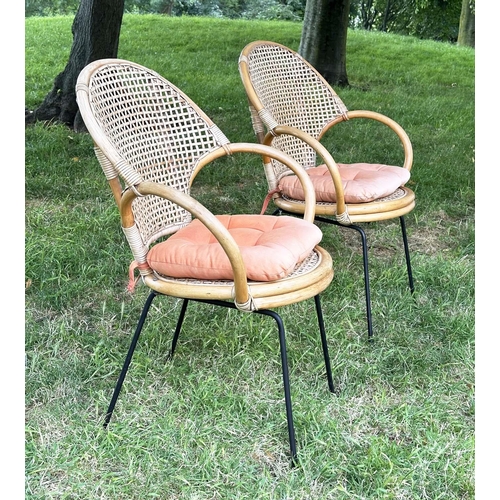 275 - TERRACE ARMCHAIRS, a pair, 1970s rattan framed wicker panelled and cane bound with metal supports, 6... 