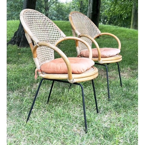 275 - TERRACE ARMCHAIRS, a pair, 1970s rattan framed wicker panelled and cane bound with metal supports, 6... 