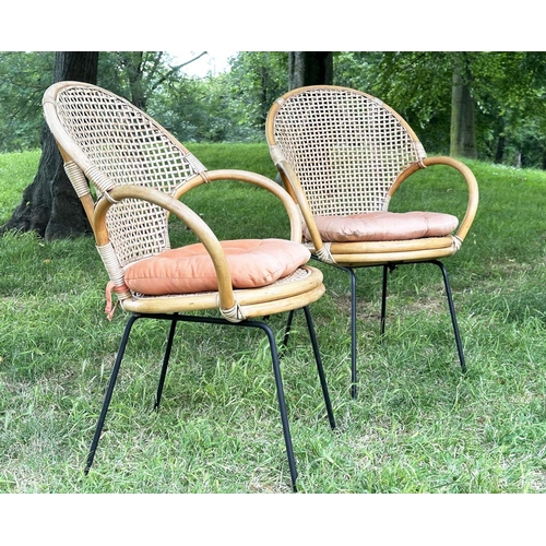 275 - TERRACE ARMCHAIRS, a pair, 1970s rattan framed wicker panelled and cane bound with metal supports, 6... 