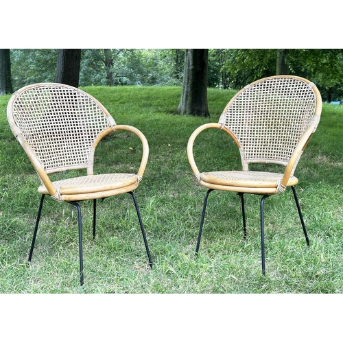 275 - TERRACE ARMCHAIRS, a pair, 1970s rattan framed wicker panelled and cane bound with metal supports, 6... 