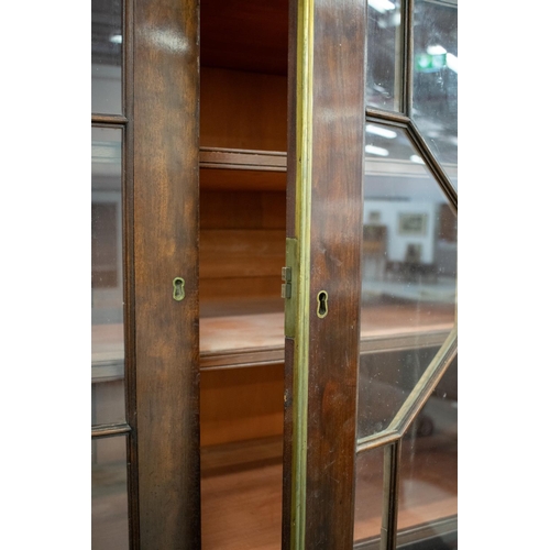 279 - BREAKFRONT LIBRARY BOOKCASE, first quarter 19th century mahogany with four glazed doors and adjustab... 