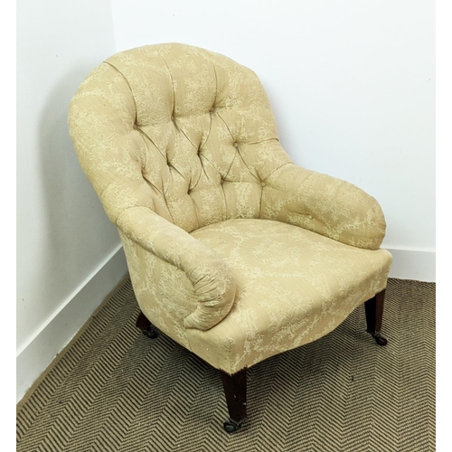 287 - ARMCHAIR, Edwardian mahogany in patterned fabric on ceramic castors, 86cm H x 70cm W.