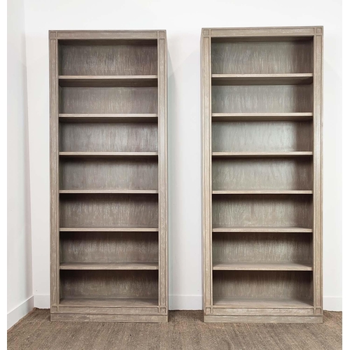 398 - OKA TALL ASHMOLEAN BOOKCASES, a pair, by Sue Jones, 89cm x 28cm x 219cm. (2)