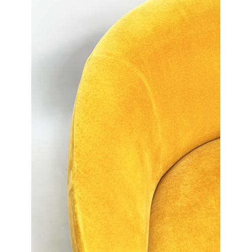 402 - HEAL'S BLOOMSBURY SOFA, soft primrose yellow velvet upholstered with curved back and splay gilt meta... 