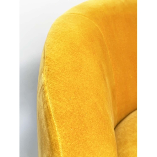 402 - HEAL'S BLOOMSBURY SOFA, soft primrose yellow velvet upholstered with curved back and splay gilt meta... 