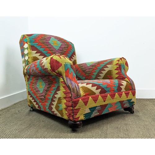 277 - ARMCHAIR, early 20th century in kilim upholstery, 78cm H c 95cm W.