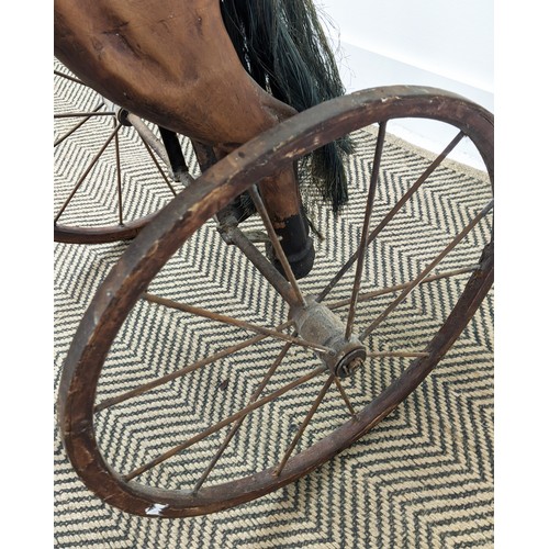 283 - HORSE TRICYCLE, antique style painted, iron and leather, 92cm H x 44cm W x 93cm L.