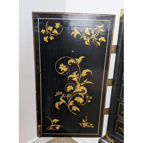 295 - CABINET ON STAND, George III and later black Japanned and gilt decorated with incised brass hinges, ... 