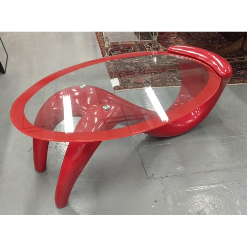 415 - LOW TABLE, contemporary glass and red fibre glass base, 122cm x 40cm H.