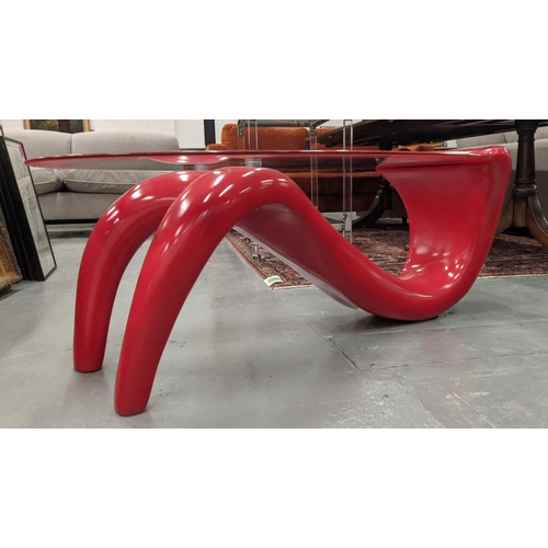 415 - LOW TABLE, contemporary glass and red fibre glass base, 122cm x 40cm H.