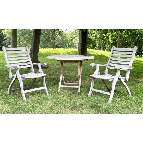 200 - GARDEN ARMCHAIRS BY ALEXANDER ROSE, a pair, well weathered teak each folding with arms together with... 