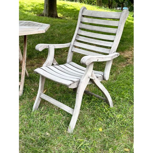 200 - GARDEN ARMCHAIRS BY ALEXANDER ROSE, a pair, well weathered teak each folding with arms together with... 