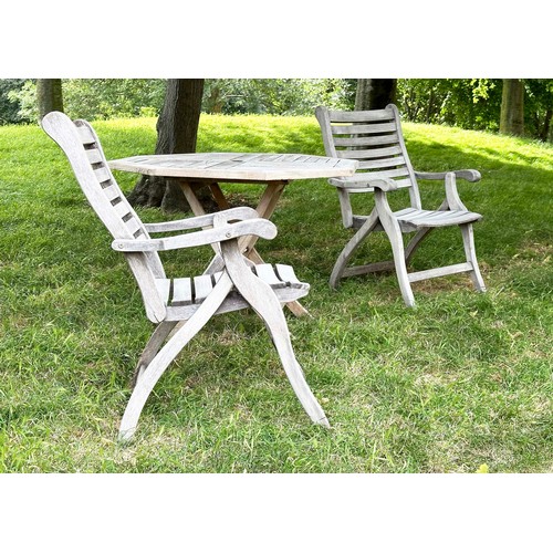 200 - GARDEN ARMCHAIRS BY ALEXANDER ROSE, a pair, well weathered teak each folding with arms together with... 