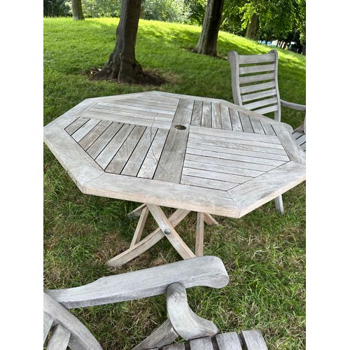 200 - GARDEN ARMCHAIRS BY ALEXANDER ROSE, a pair, well weathered teak each folding with arms together with... 