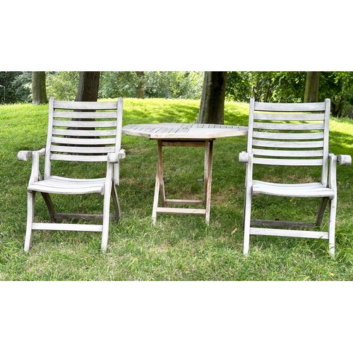 200 - GARDEN ARMCHAIRS BY ALEXANDER ROSE, a pair, well weathered teak each folding with arms together with... 