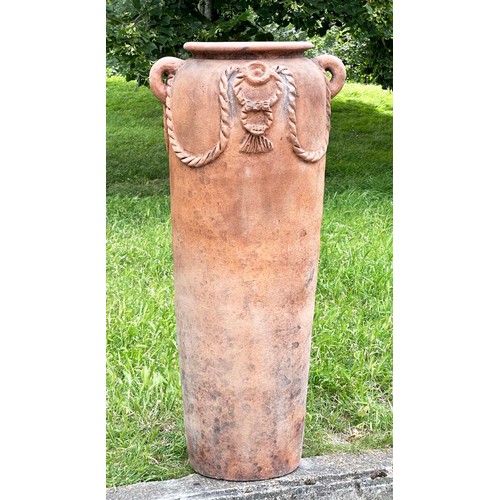 272 - GARDEN URN, tall weathered terracotta with moulded handles and rope swag decoration, 110cm H.