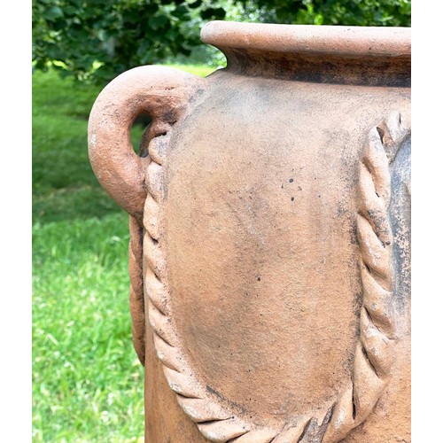 272 - GARDEN URN, tall weathered terracotta with moulded handles and rope swag decoration, 110cm H.