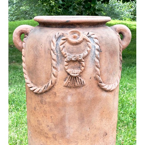 272 - GARDEN URN, tall weathered terracotta with moulded handles and rope swag decoration, 110cm H.