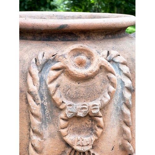 272 - GARDEN URN, tall weathered terracotta with moulded handles and rope swag decoration, 110cm H.