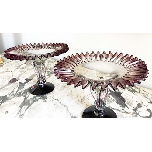 158 - MURANO GLASS TAZZE, a pair, ruffle rimmed circa 1950, clear and aubergine on pierced stem and spread... 