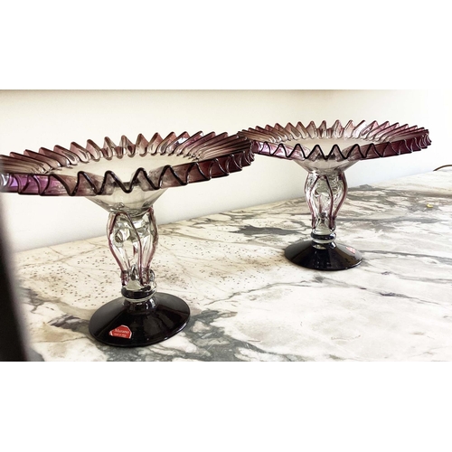 158 - MURANO GLASS TAZZE, a pair, ruffle rimmed circa 1950, clear and aubergine on pierced stem and spread... 