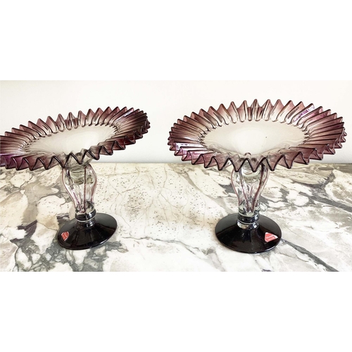 158 - MURANO GLASS TAZZE, a pair, ruffle rimmed circa 1950, clear and aubergine on pierced stem and spread... 