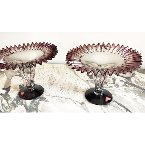 158 - MURANO GLASS TAZZE, a pair, ruffle rimmed circa 1950, clear and aubergine on pierced stem and spread... 