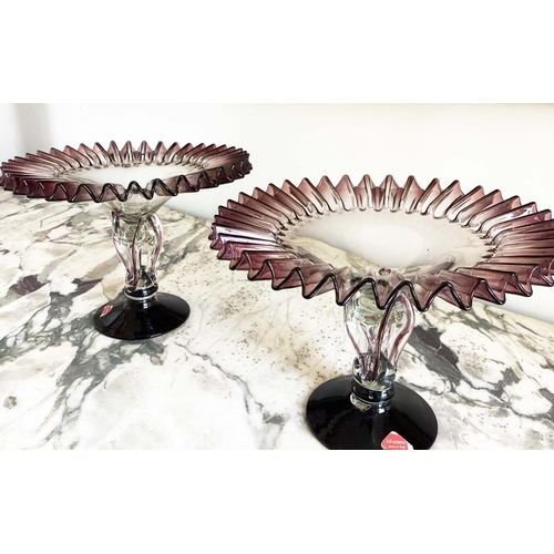 158 - MURANO GLASS TAZZE, a pair, ruffle rimmed circa 1950, clear and aubergine on pierced stem and spread... 