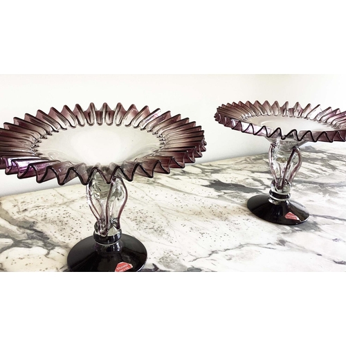 158 - MURANO GLASS TAZZE, a pair, ruffle rimmed circa 1950, clear and aubergine on pierced stem and spread... 