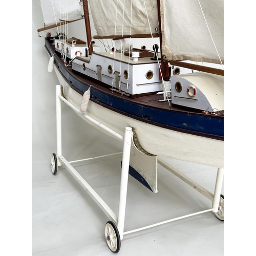 155 - POND YACHT, large twin mast scratch built with detail, sails and lead weight keel, all on stand with... 