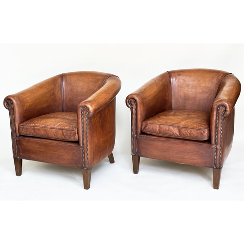 187 - TUB ARMCHAIRS, a pair, brass studded hand finished soft tan brown leather with bow backs and taperin... 