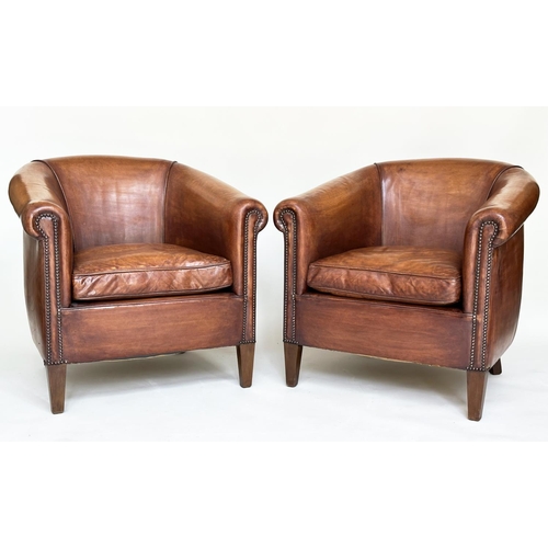 187 - TUB ARMCHAIRS, a pair, brass studded hand finished soft tan brown leather with bow backs and taperin... 