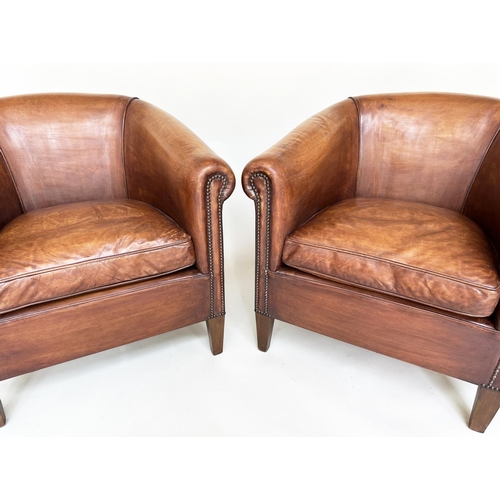 187 - TUB ARMCHAIRS, a pair, brass studded hand finished soft tan brown leather with bow backs and taperin... 