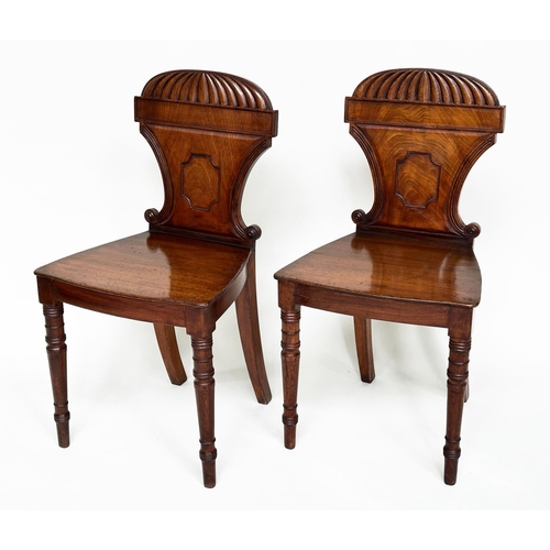 196 - HALL CHAIRS, a pair, Regency mahogany with arched and scrolled backs, panel seats and turned support... 