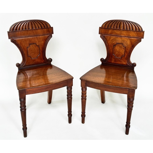 196 - HALL CHAIRS, a pair, Regency mahogany with arched and scrolled backs, panel seats and turned support... 