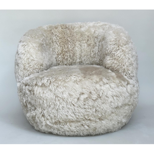 413 - SHEEPSKIN SWIVEL ARMCHAIR, real sheepskin upholstered on swivel base, 83cm W.