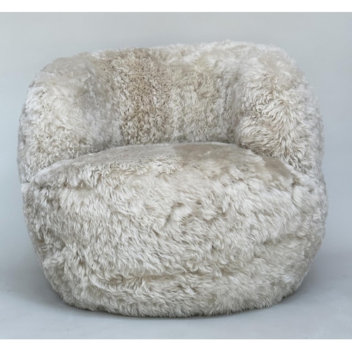 413 - SHEEPSKIN SWIVEL ARMCHAIR, real sheepskin upholstered on swivel base, 83cm W.