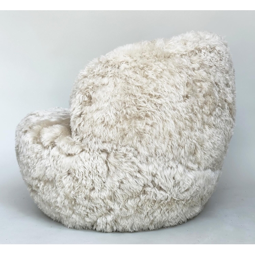 413 - SHEEPSKIN SWIVEL ARMCHAIR, real sheepskin upholstered on swivel base, 83cm W.