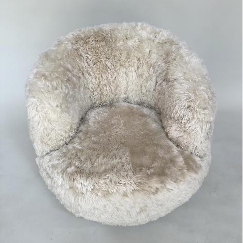 413 - SHEEPSKIN SWIVEL ARMCHAIR, real sheepskin upholstered on swivel base, 83cm W.