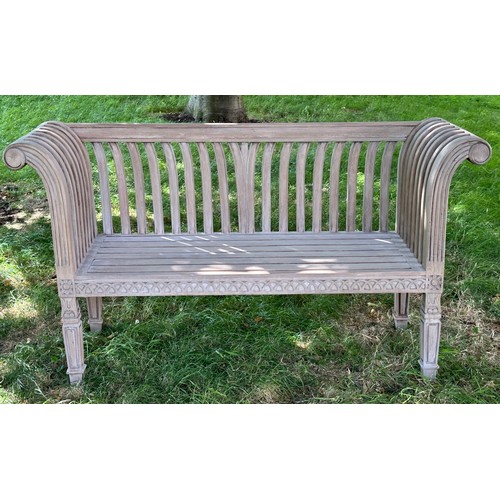 273 - COLONIAL STYLE GARDEN BENCH, weathered teak with outswept scrolled and carved uprights and slatted s... 