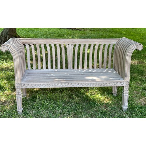 273 - COLONIAL STYLE GARDEN BENCH, weathered teak with outswept scrolled and carved uprights and slatted s... 