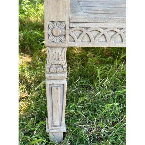 273 - COLONIAL STYLE GARDEN BENCH, weathered teak with outswept scrolled and carved uprights and slatted s... 